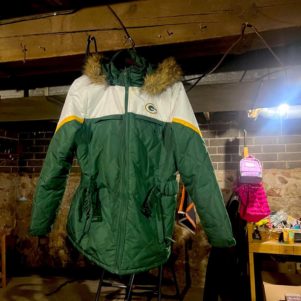 Barely worn NFL Packer jacket. Longer jacket with a fur hood and detachable belt